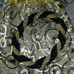 Black and gold bead bracelet.